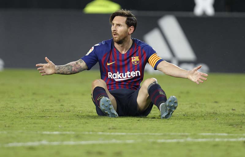 Barcelona forward Lionel Messi reacts after failing to score against Valencia during the Spanish La Liga soccer match between Valencia and Barcelona, at the Mestalla stadium in Valencia, Spain on Sunday.