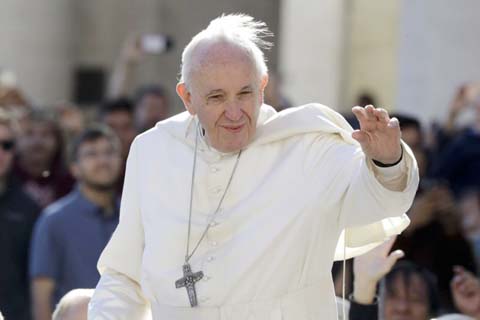 Pope Francis arrives for his weekly general audience in St. Peter's Square at the Vatican. South Korea says North Korean leader Kim Jong Un wants Pope Francis to visit North Korea.