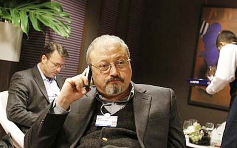 Saudi Arabian journalist Jamal Khashoggi speaks on his cellphone at the World Economic Forum in Davos, Switzerland