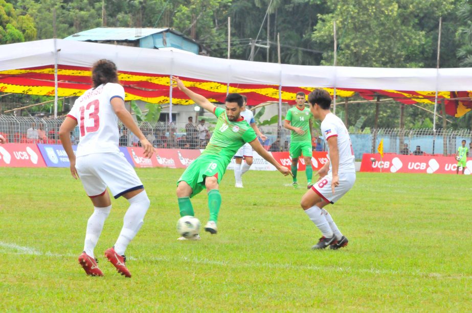 An action from the first semi-final match of the Bangabandhu Gold Cup International Football Tournament between Tajikistan and Philippines at the Bir Shreshtha Shaeed Ruhul Amin Stadium in Cox's Bazar on Tuesday.