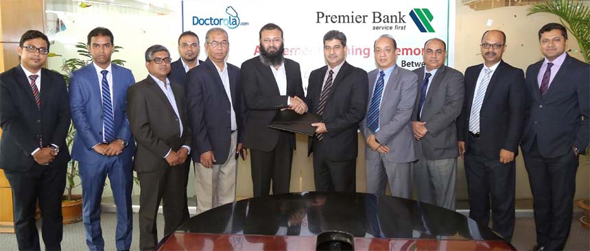 Golam Awlia, AMD of Premier Bank Limited and Mohammad Abdul Matin Emon, CEO of Doctorola Limited, exchanging an agreement signing documents at the Bank's head office in the city recently. Under the deal, all credit cardholders of the Bank will enjoy up t