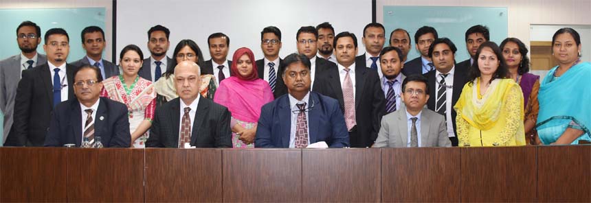 Mosleh Uddin Ahmed, Managing Director of NCC Bank Limited, poses for a photo session with the participants of a 3 day-long training course on "Export Finance- RMC Sectors" at the Bank's Training Institute in the city recently. Khondoker Nayeemul Kabir,