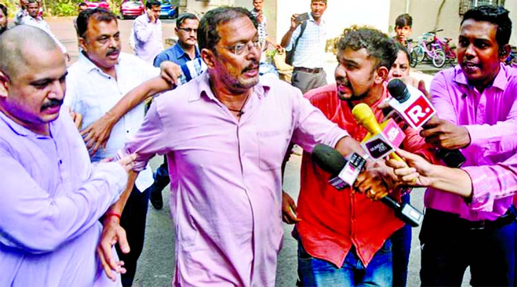 Bollywood actor Nana Patekar reacts while talking to the media in Mumbai on Monday.