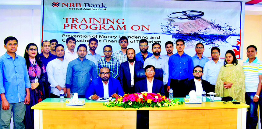 S M Rabiul Hassan, Executive Director of Bangladesh Bank, poses for photo session with the participants of a day-long training programme on "Prevention of Money Laundering & Terrorist Financing" as chief guest organised by NRB Bank Limited at Chattogram