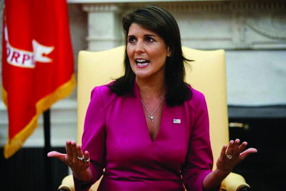 Outgoing US Ambassador to the United Nations Nikki Haley speaks during a meeting with President Donald Trump (Not seen) in the Oval Office of the White House on Tuesday.