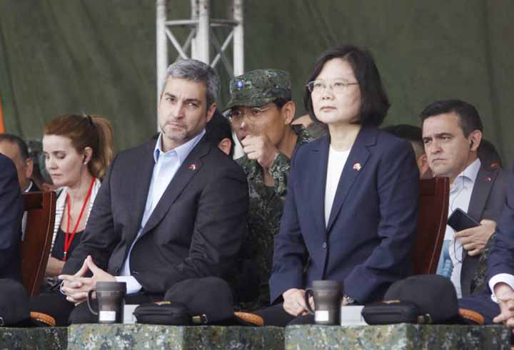 Taiwan's President Tsai Ing-wen, right, and Paraguay's President Mario Abdo Benitez listen to report as they attend a military drill in Taoyuan city, Nothern Taiwan, on Tuesday.