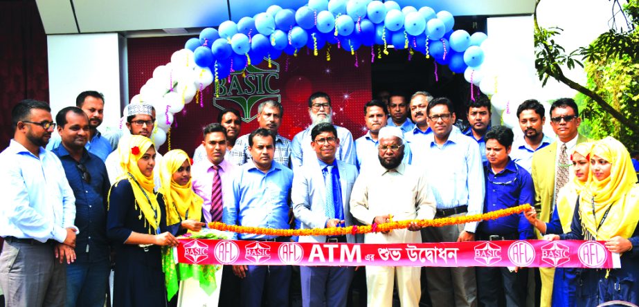 Muhammad Awal Khan, Managing Director of BASIC Bank Limited, inaugurating its ATM booth with the associated with PRAN-RFL Group at Lalmai in Cumilla on Sunday. RN Paul, Managing Director of PRAN-RFL Group and senior officials from both the organizations w