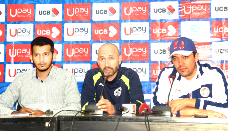 Tajikistan head coach Alisher Tukhtaev (centre) addressing a press conference at the conference room in Bangladesh Football Federation House on Thursday.