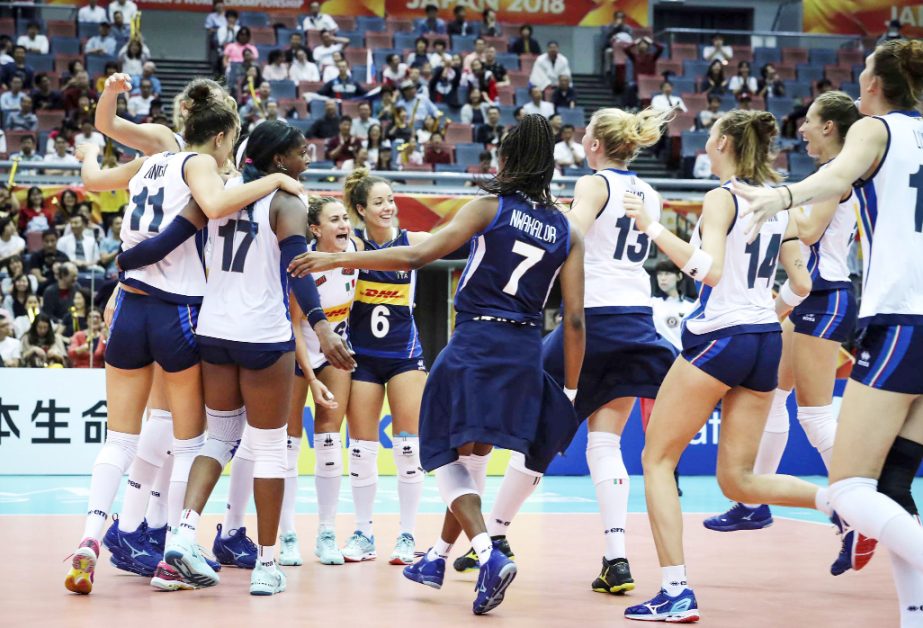 In this photo provided by FIVB, Italy's players celebrate during their second round match against Russia at the FIVB Volleyball Women's World Championship in Osaka, western Japan on Wednesday
