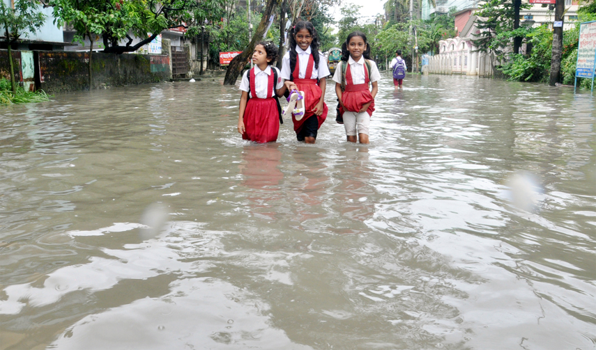 CDA Road in the Port City has been submerged due to waterlogging caused by heavy rainfall yesterday. Students seen crossing the road under knee deep water .