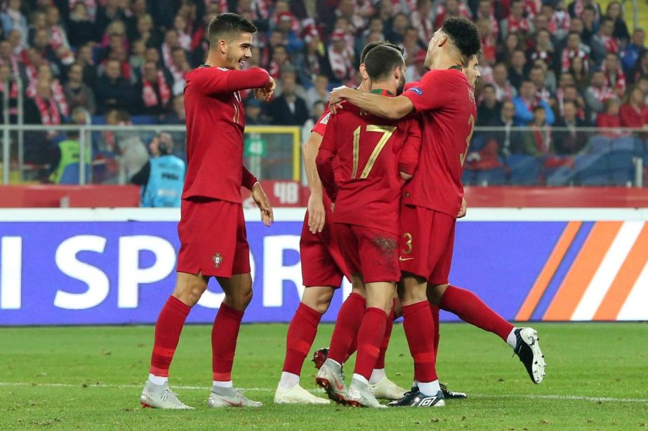 Portuguese players celebrate scoring their side's second goal during the UEFA Nations League soccer match between Poland and Portugal at the Silesian Stadium Chorzow, Poland on Thursday.