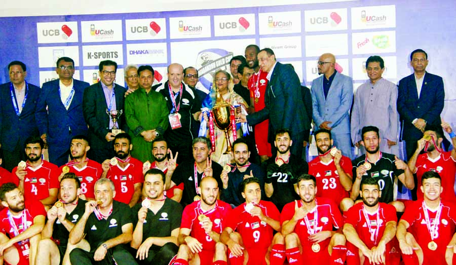 Prime Minister Sheikh Hasina, the chief guest of the prize-giving ceremony with the members of Palestine Football team, the champions of the Bangabandhu Gold Cup International Football Tournament pose for a photo session at the flood-lit Bangabandhu Natio