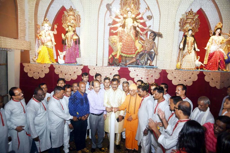 Dr Nisar Uddin Ahmed Monju, Acting CCC Mayor inaugurating Durga Puja programme in the Port City yesterday.