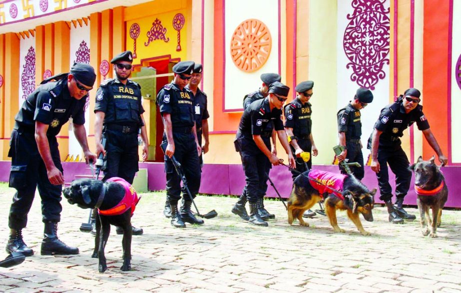 RAB members with Dog Squad scanning ground on the premises of Banani Puja Mandop for security measures on Monday on the occasion of Durga Puja, the greatest religious festival of the Hindu community.