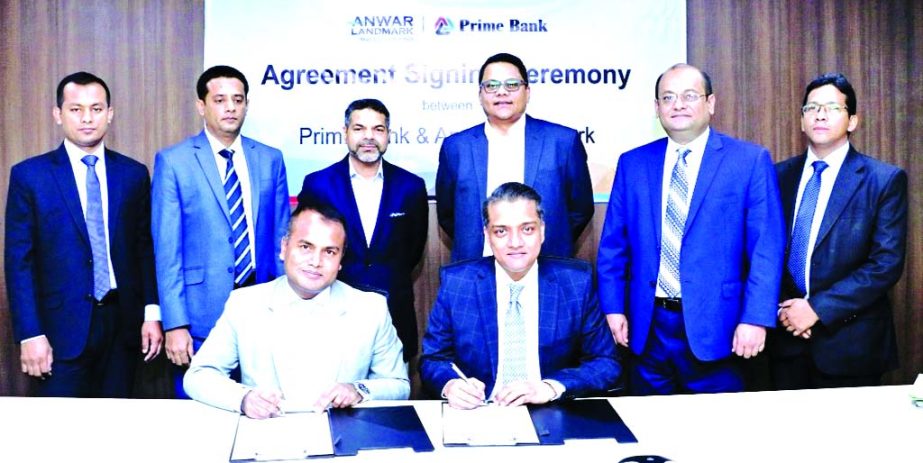 ANM Mahfuz, Head of Consumer Banking Division of Prime Bank Limited and Noor-E-Alam Siddike, Executive Director (Sales & Marketing) of Anwar Landmark Limited, sign an agreement at the Bank's head office in the city recently. Under the deal, both organiza