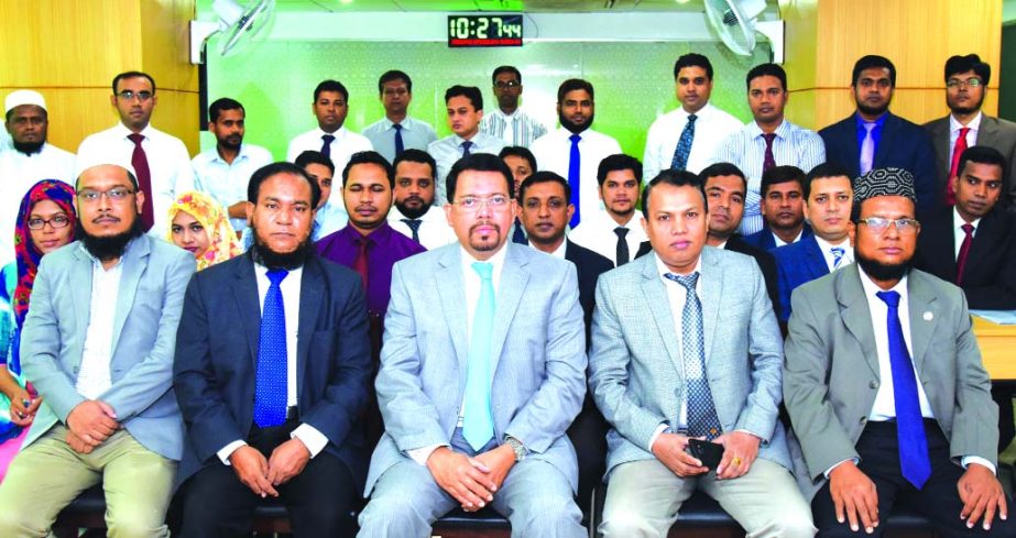 Farman R Chowdhury, Managing Director of Al-Arafah Islami Bank Ltd, poses with the participants of a day-day long training workshop on 'RMG Financing' at its Training and Research Institute on Monday. Principal of the Institute and Executive Vice Presid
