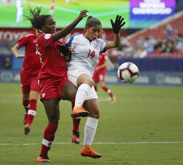 Canada forward Nichelle Price (front left) attempts to control the ball near Panama defender Maryorie Perez(14) during the second half of a soccer match at the CONCACAF women's World Cup qualifying tournament in Frisco, Texas on Sunday.