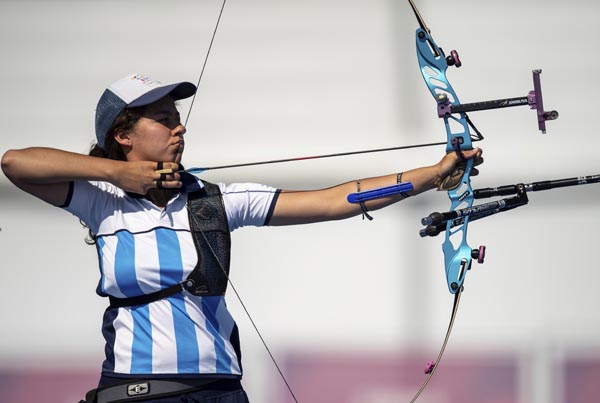 In this photo provided by the OISIOC, Agustina Sofia Giannasio competes in the Semifinal of the Archery Mixed International Team Event at the Archery Range in Tecnopolis Park at the Youth Olympic Games in Buenos Aires, Argentina on Sunday.