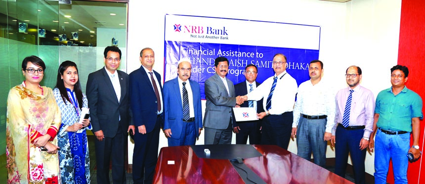 Md. Mehmood Hossain, Managing Director of NRB Bank Limited, handing over a cheque of Tk.100,000- to AMM Shahadat Hossain, President of Chandanaish Samity-Dhaka at the head office of the Bank in the city recently to support their Scholarship program for t