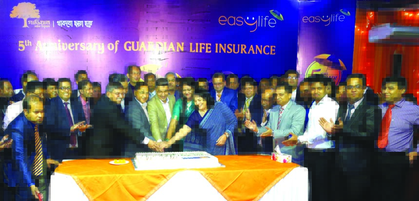 M M Monirul Alam, Managing Director of Guardian Life Insurance Limited (GLIL), along with its Sponsor Director Syed Nasim Manzur, inaugurating its 5th Anniversary programme at a convention centre in the city recently. Tapan Chowdhury, Managing Director of