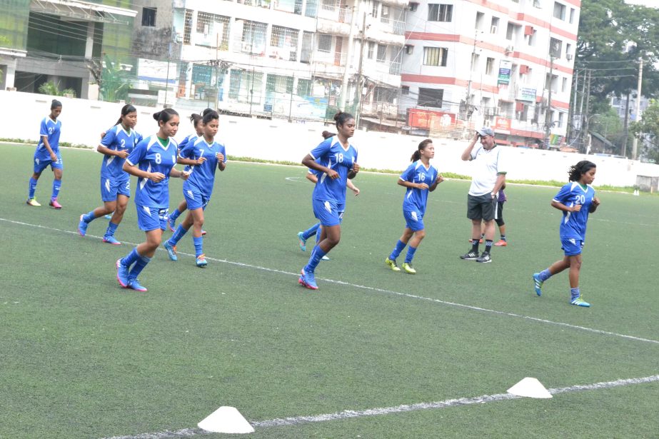 Members of Bangladesh Under-19 National Women's Football team taking part at the practice at the BFF Artificial Turf on Tuesday.