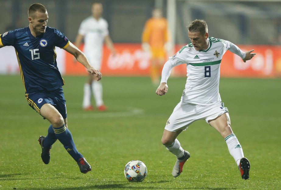 Northern Ireland's Steven Davis (right) challenges for the ball with Bosnia's Toni Sunjic during the UEFA Nations League soccer match between Bosnia and Northern Ireland at the Grbavica stadium in Sarajevo, Bosnia on Monday.
