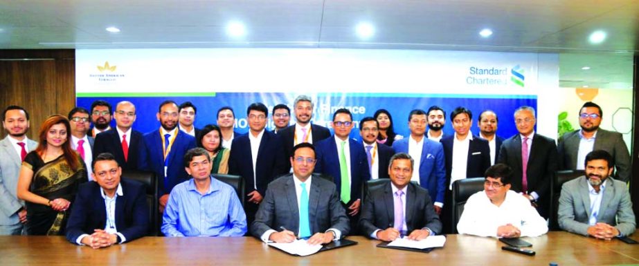 Shehzad Munim, Managing Director of British American Tobacco (BAT) Bangladesh and Naser Ezaz Bijoy, CEO of Standard Chartered Bangladesh, signing an agreement to avail the 'Supply Chain Finance' programme (a financing programme for the distributors and