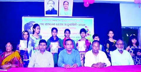 RANGPUR: Deputy Director, Local Government, Ruhbul Amin Mian (middle) with children winners of different competitions arranged in celebration of the 54th birth anniversary of Sheikh Russel at a function as Chief Guest on Thursday