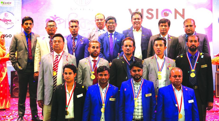 RN Paul, Managing Director of RFL, poses for a photograph with the participants of the Dealers' Conference of Vision Electronics Limited at International Convention City Bashundhara recently. Nur Alam, Mahbubur Rahman and Rasheduzzaman, Head of Operatio