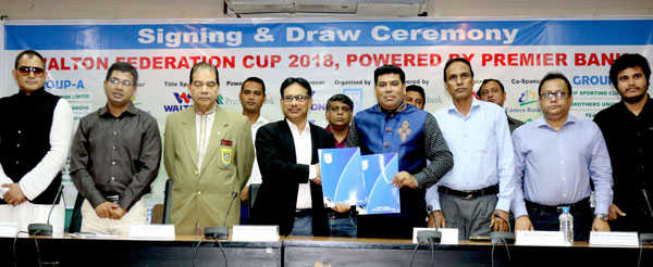 Senior Vice-President of Bangladesh Football Federation (BFF) Abdus Salam Murshedy shaking hands with FM Iqbal Bin Anwar Dawn, Senior Operative Director (Head of Games & Sports) of Walton Group after signing an agreement between BFF and Walton Group at th