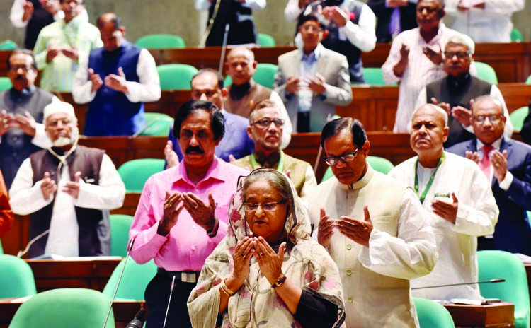 Prime Minister Sheikh Hasina offering munajat at the 23rd session of the Jatiya Sangsad after obituary motions yesterday . Photo : BSS