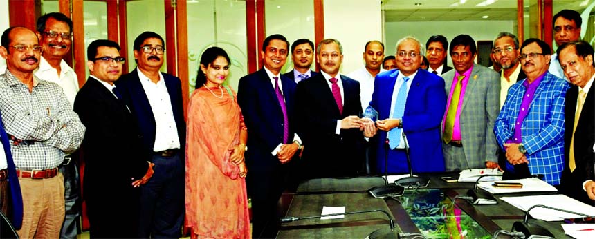 Mohammad Shams-Ul Islam, Managing Director of Agrani Bank Limited, receiving the "2017 Performance Excellence Award" from the representative of Citibank N.A USA at the Agrani Bank head office on Wednesday.