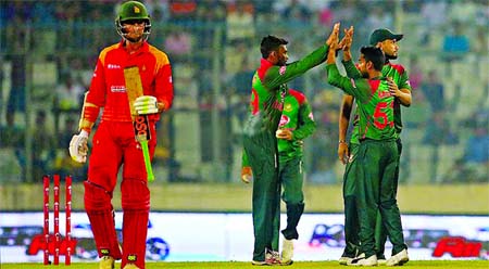 Mehidy Hasan Miraz of Bangladesh celebrates with his teammates after dismissal of Craig Ervine of Zimbabwe in the first ODI match between Bangladesh and Zimbabwe at the Sher-e-Bangla National Cricket Stadium in the city's Mirpur on Sunday.