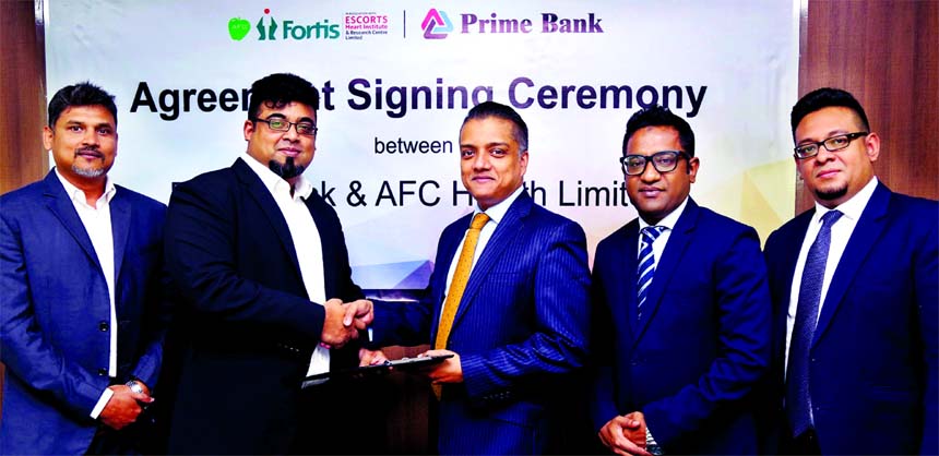 ANM Mahfuz, Head of Consumer Banking of Prime Bank Limited and Nazeem A. Choudhury, Chief Executive of AFC Health Limited, exchanging an agreement signing documents at the Bank's head office in the city recently. Under the deal, Monarch (Priority Banking