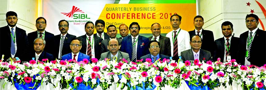 Quazi Osman Ali, Managing Director of Social Islami Bank Limited (SIBL), poses for a photograph with the participants of a daylong Business Conference-2018 to evaluate the business position of the Bank at a hotel in the city on Saturday. Ihsanul Aziz, Kaz