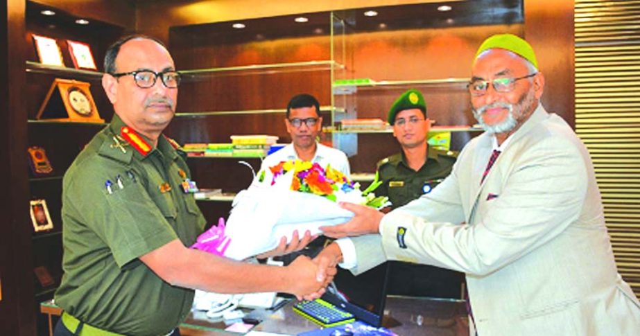 Mohammad Jalaluddin, Managing Director of Ansar-VDP Unnayan Bank, congratulating its newly appointed Chairman Major General Kazi Sharif Kaikobad with bouquet at the Bank's head office in the city recently.