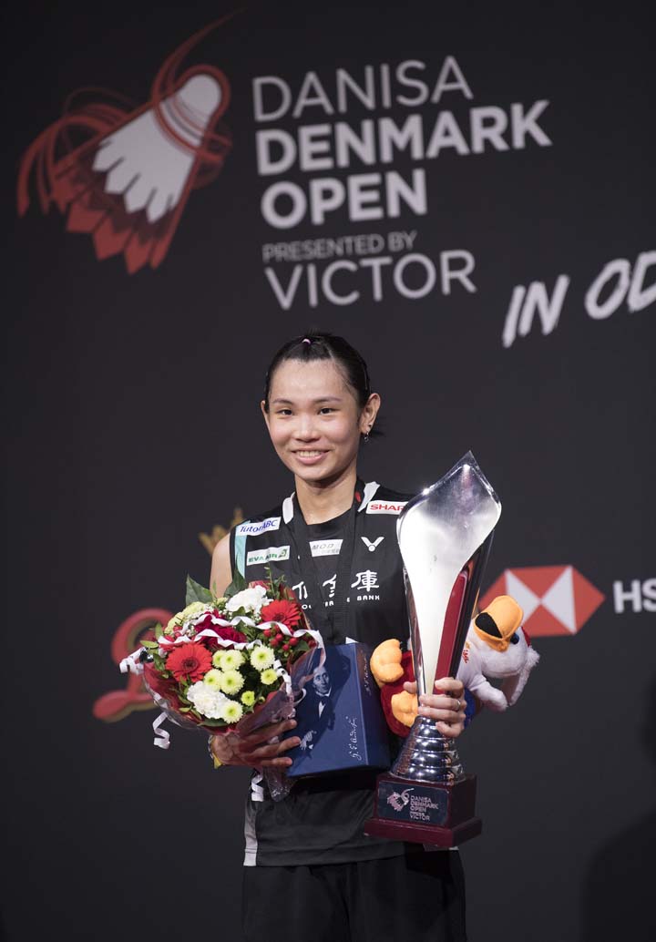 Tai Tzu Ying of Chinese Taipei, holds the trophy after winning the final match against Saina Nehwal of India, during the Women's Singles Final match at the Denmark Open badminton championship, in Odense, Denmark on Sunday.