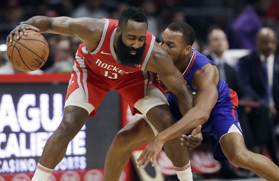 Houston Rockets' James Harden (13) is defended by Los Angeles Clippers' Avery Bradley during the first half of an NBA basketball game on Sunday.