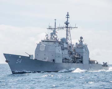 Photo shows the Ticonderoga-class guided-missile cruiser USS Antietam (CG 54) sails in the South China Sea.