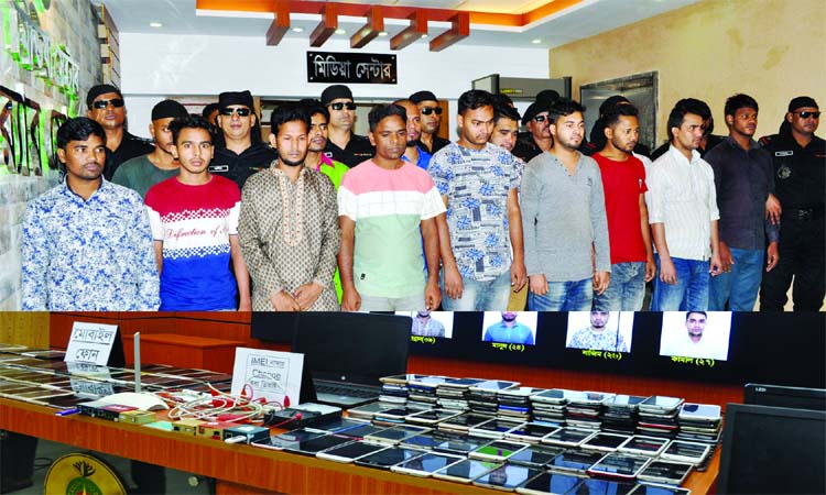RAB mobile team in a drive in city's Gulshan area arrested 15 active members of criminal gangs with huge mobile phones and IMEI number changing materials. This photo was taken from RAB media centre on Tuesday.