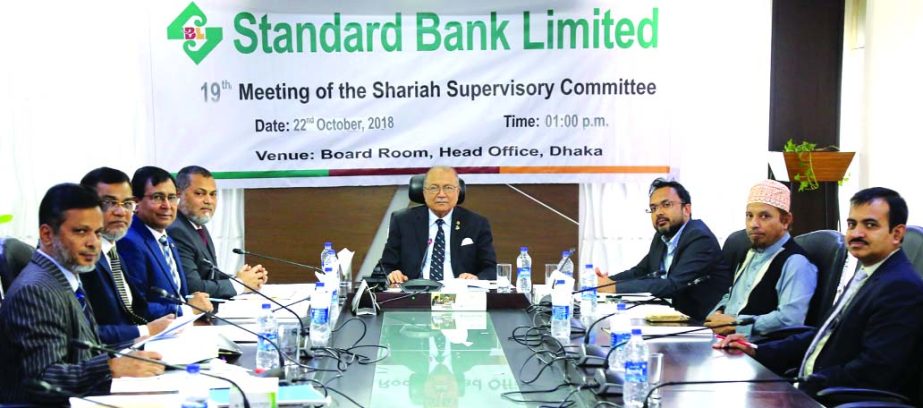 Kazi Akram Uddin Ahmed, Chairman of Standard Bank Limited, presiding over the 19th Meeting of the Shariah Supervisory Committee at the Bank's head office in the city Monday. Mamun-Ur-Rashid, Managing Director, Md. Tariqul Azam, AMD, Md. Motaleb Hossain,