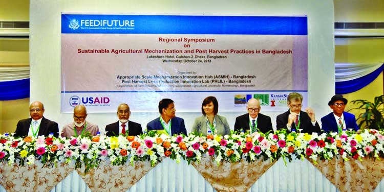 Distinguished persons at a day-long regional symposium on 'Sustainable Agricultural Mechanization and Post Harvest Practices in Bangladesh' at Lakeshore Hotel in the city on Wednesday.