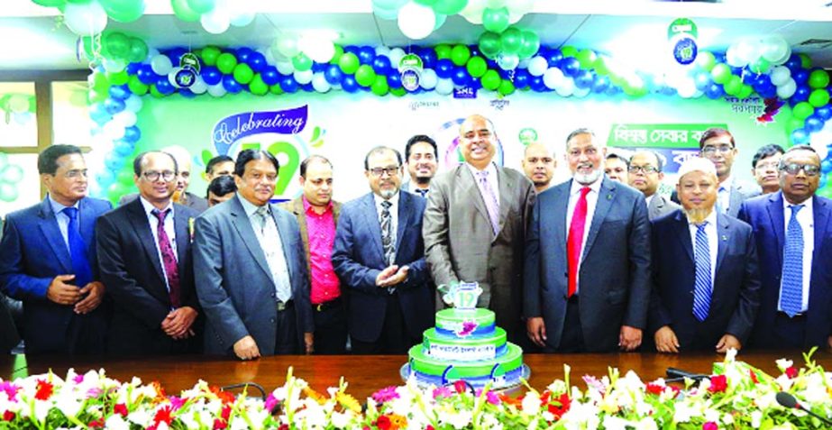 Syed Waseque Md Ali, Managing Director of First Security Islami Bank Limited, inaugurating its 19th anniversary programme by cutting cake at its head office in the city on Thursday. Abdul Aziz, AMD, Md. Mustafa Khair, DMD, divisional heads and other high
