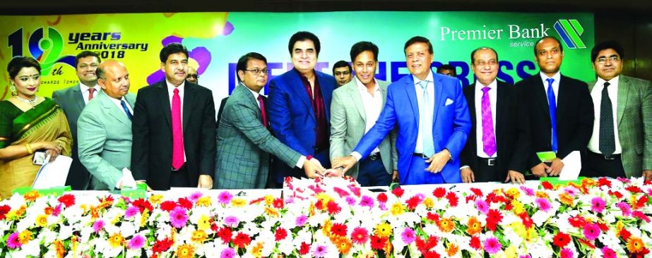 Dr. HBM Iqbal, Chairman, Board of Directors of Premier Bank Limited along with its advisor Muhammad Ali, Managing Director M Reazul Karim inaugurating its 19th anniversary by cutting cake at the Bank's Head Office in the city on Thursday. Jamal G Ahmed,