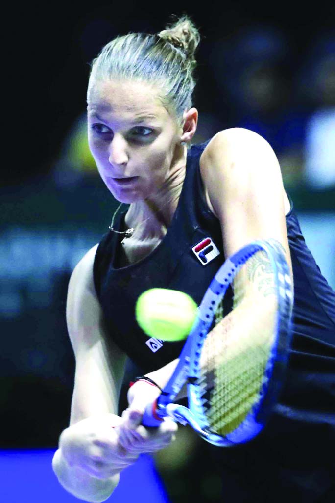 Karolina Pliskova of the Czech Republic, plays a return shot while competing against Petra Kvitova of the Czech Republic, during their women's singles match at the WTA tennis finals in Singapore on Thursday.