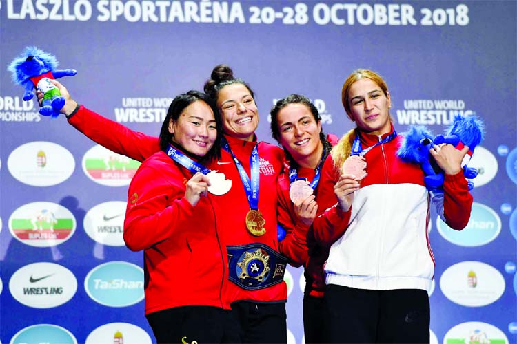 From left: silver medalist Nasanburmaa Ochirbat of Mongolia, gold medalist Justina Renay Di Stasio of Canada, bronze medalists Martina Kuenz of Austria and Buse Tosun of Turkey during the award ceremony of the women's 72kg category of the Wrestling World
