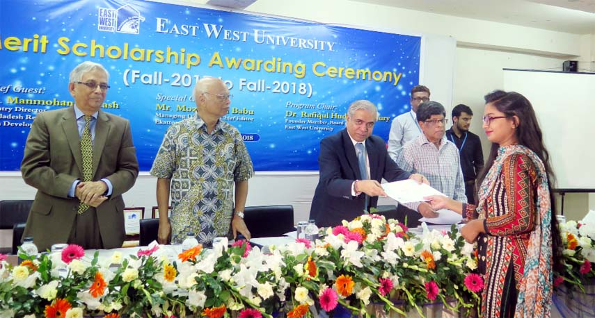 Manmohan Parkash, Country Director, Bangladesh Resident Mission, Asian Development Bank distributes 'Merit Scholarship Award 2018' among the students of East West University at University Campus in the capital on Wednesday.