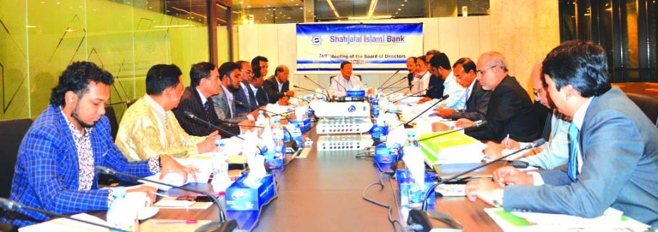 Akkas Uddin Mollah, Chairman, Board of Directors of Shahjalal Islami Bank Limited (SJIBL), presiding over its 269th meeting at its head office in the city recently. M. Shahidul Islam, Managing Director, Mohammad Golam Quddus, Khandaker Shakib Ahmed, Vice-