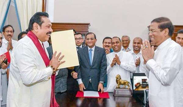 Mahinda Rajapakse (left) was sworn in as Sri Lankan Prime Minister by President Maithripala Sirisena.