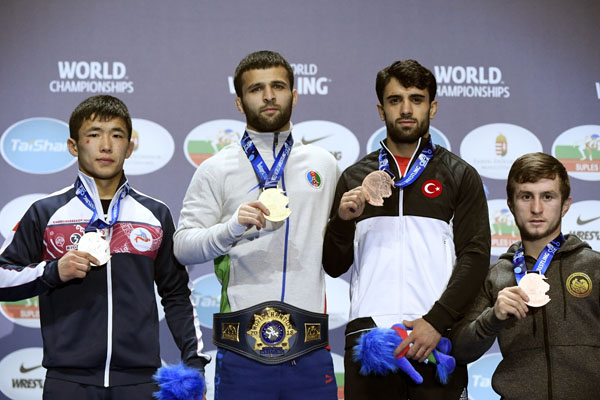 From left to right: Silver medalist Zholaman Sharshenbekov of Kyrgyzstan, gold medalist Eldaniz Azizli of Azerbaijan, bronze medalists Ekrem Ozturk of Turkey and Nugzari Tsurtsumia of Georgia during the award ceremony of men's Greco-Roman 55kg category o